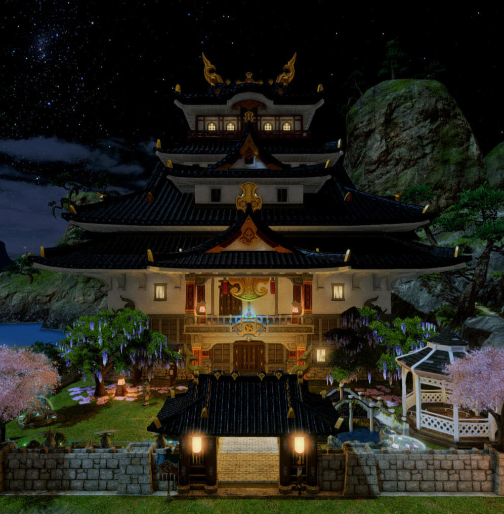 A large ornate Japanese style home in Shirogane. It has white walls and a dark blue tiled roof.